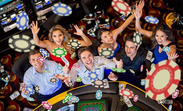 Happy group of people winning at the casino